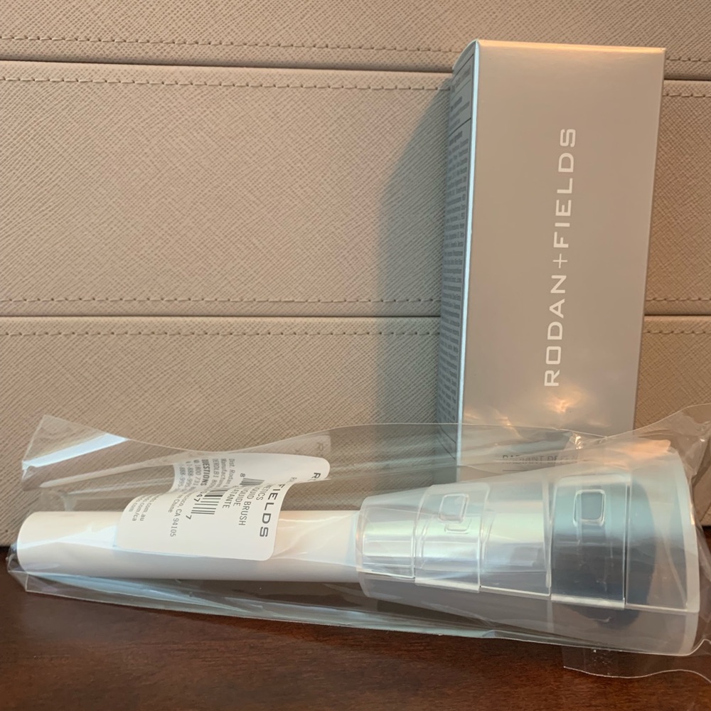 Rodan + Fields Radiant Defense (Shell) and brush